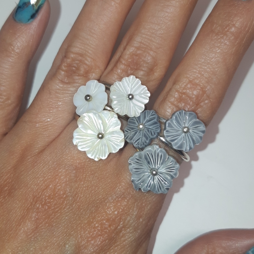 Two sets of flower stackable rings